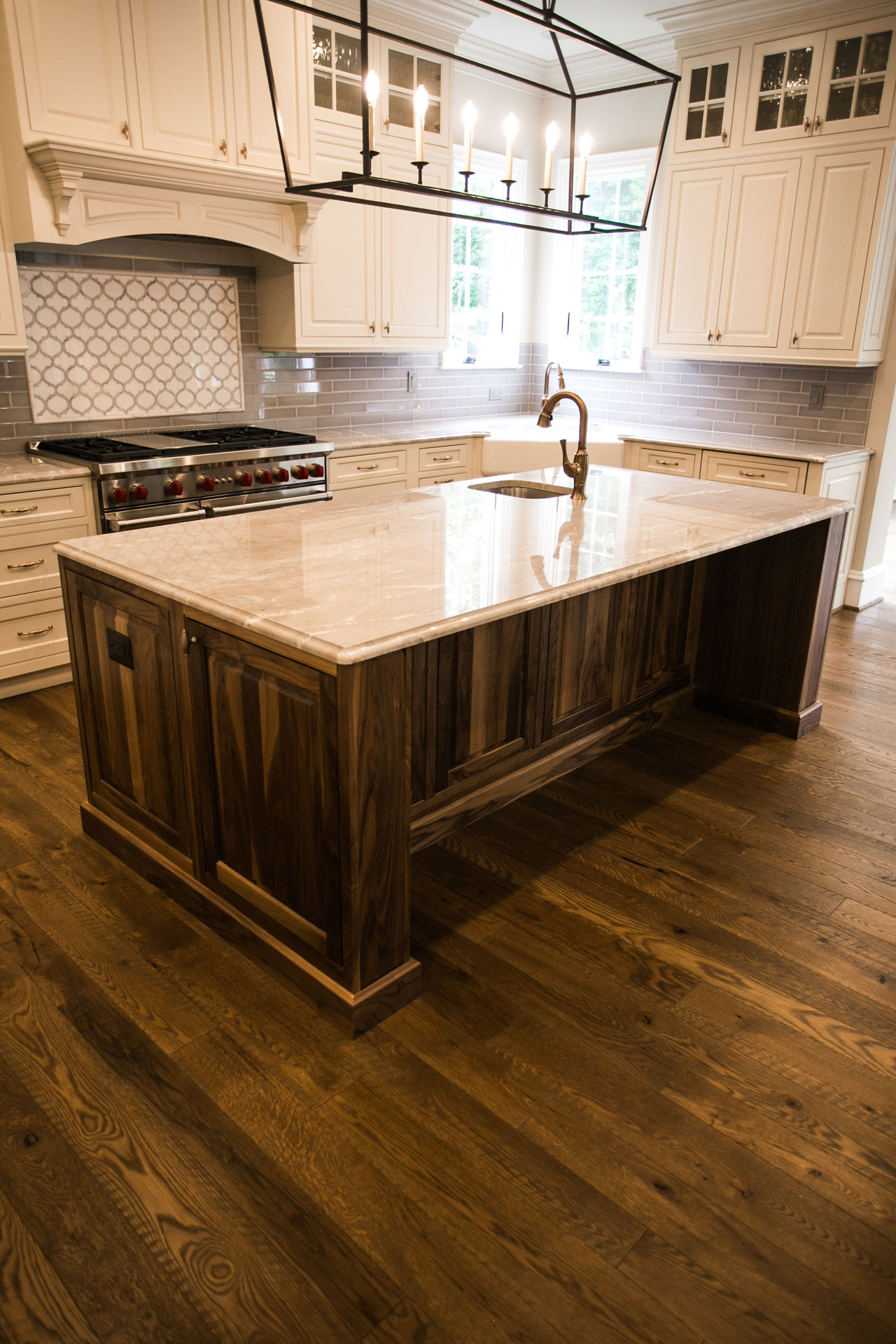 Chestnut Color Flooring in Kitchen with Island by Cochran's Lumber