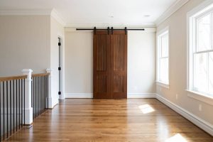 Image of New Wood Flooring with Sliding Bar Door