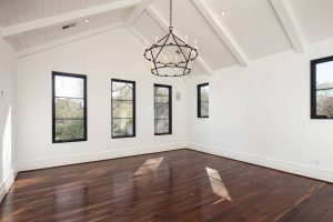 Image of rich dark wood flooring with vaulted ceilings on second floor