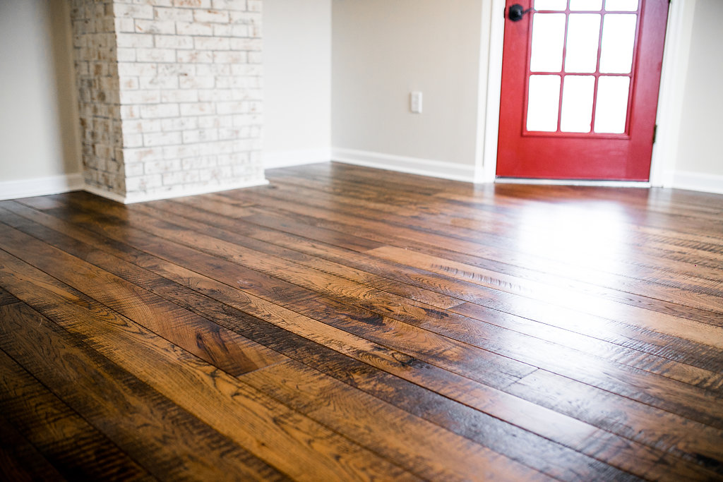Wide plank wood flooring with custom finish texture
